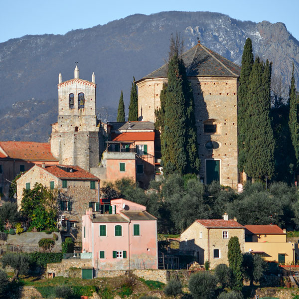 The unusual medieval ribbed bell tower of the church of Saint Eusebio in Perti stands out against the rural surroundings of Finale Ligure.